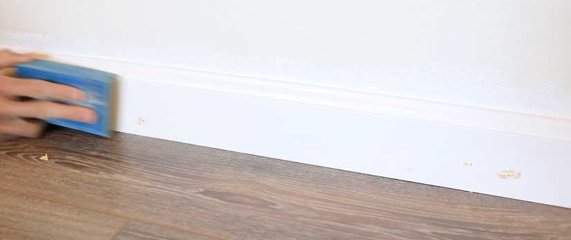 Fill nail holes in baseboard