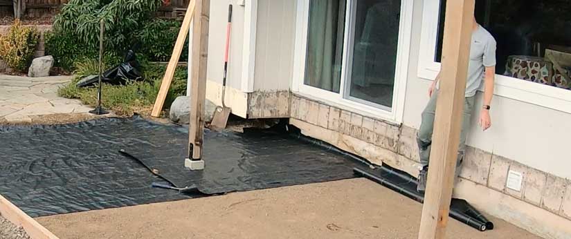 Laying geotextile fabric