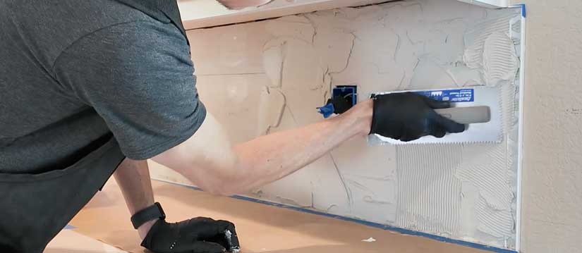 Applying thinset to drywall