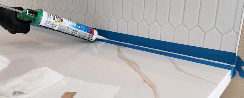 Caulking backsplash tile